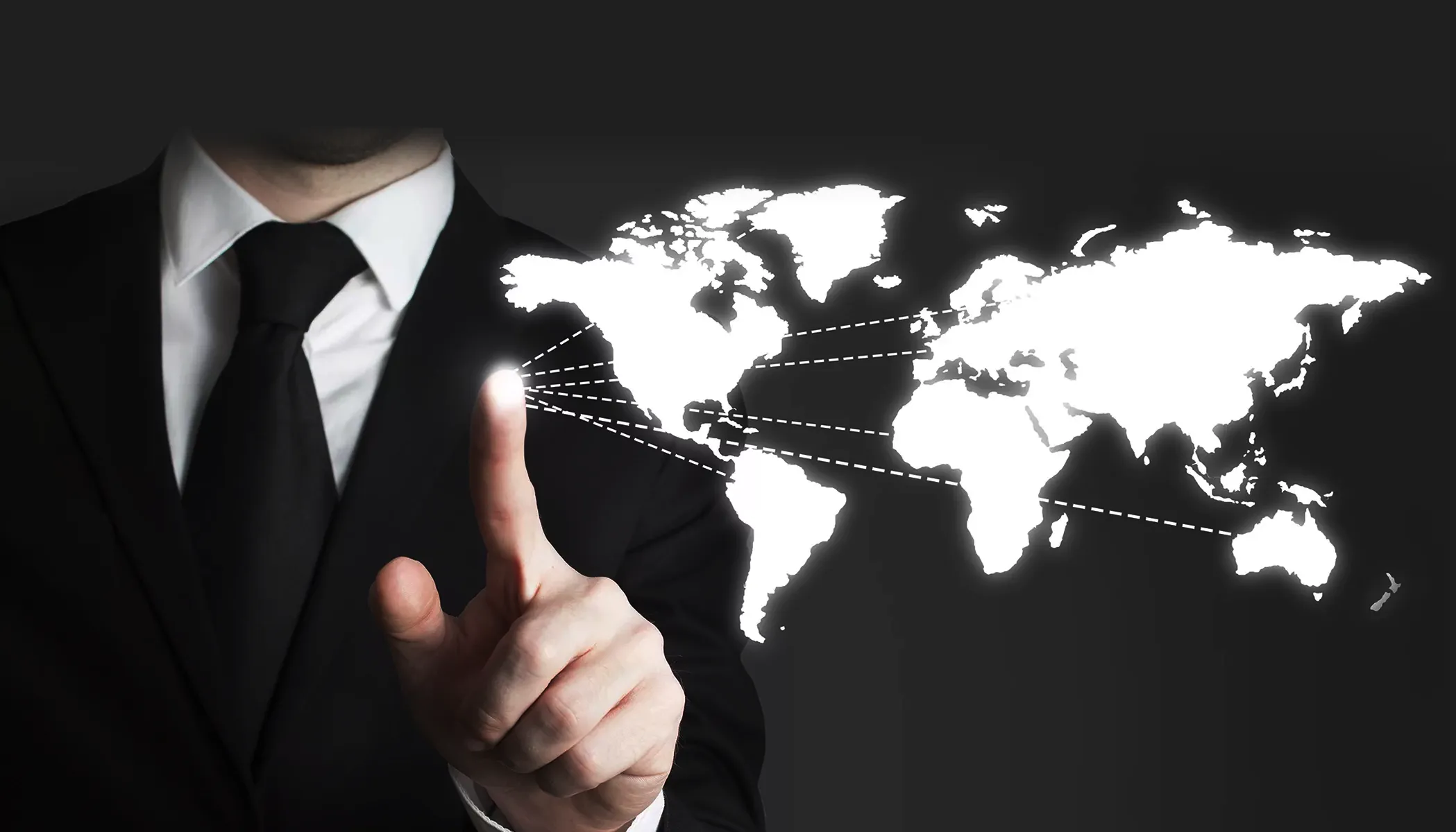 Businessman pointing to a global energy market map